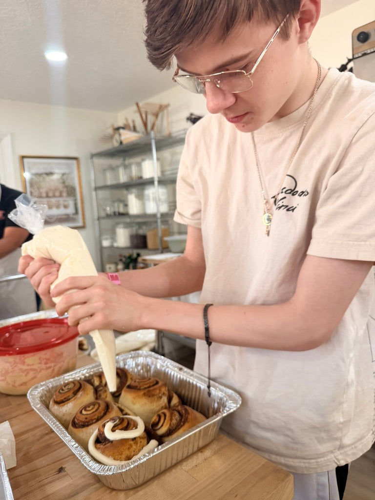Young cooks working together in a private Eat Well ABQ class