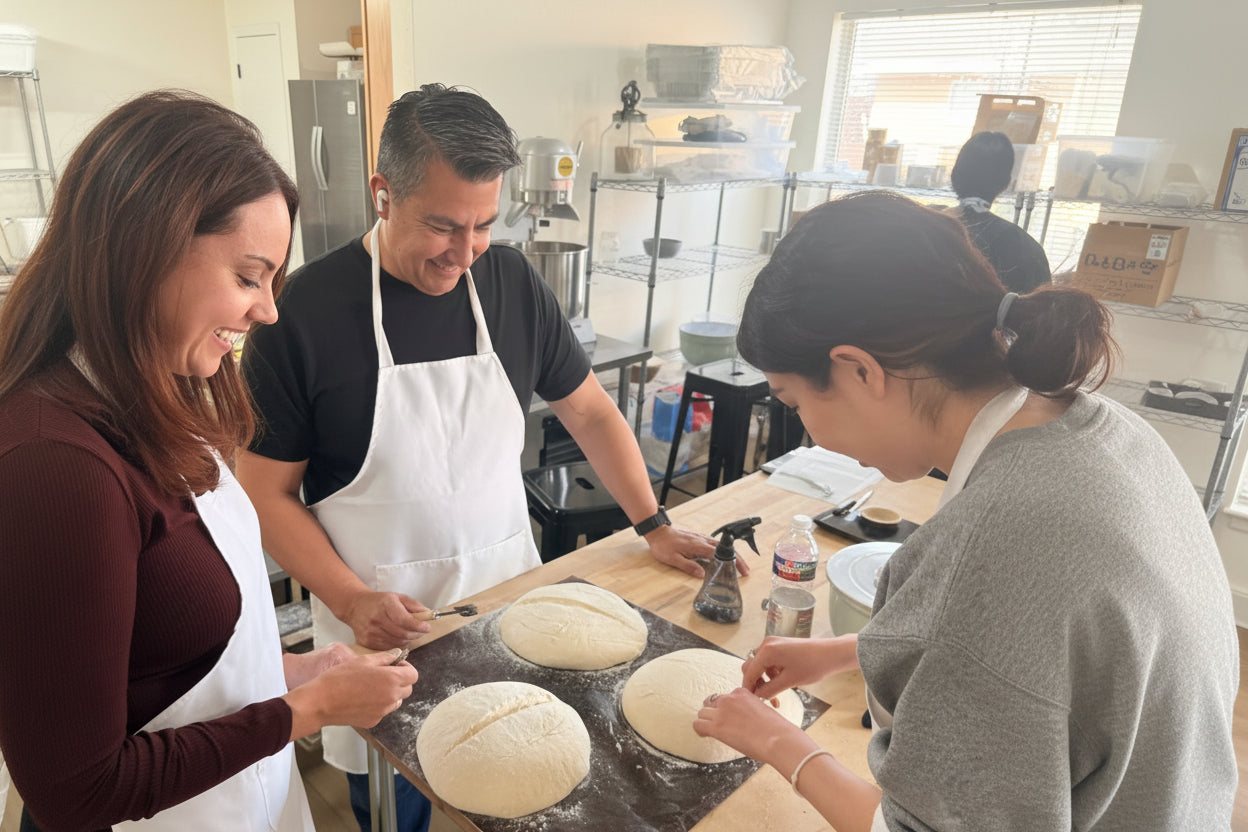 Hands-on sourdough bread class with students shaping artisan dough at Eat Well ABQ