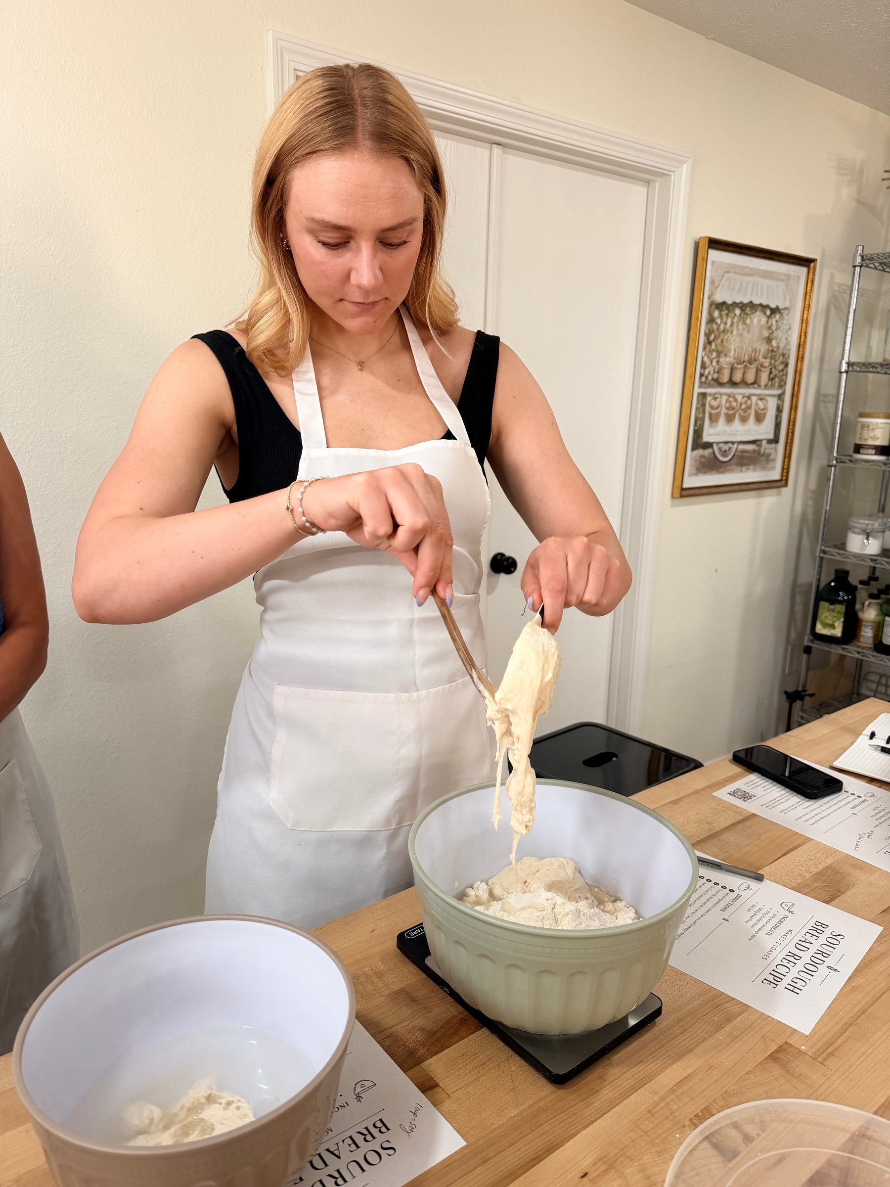 Friends learning sourdough in a private baking class at Eat Well ABQ in Albuquerque