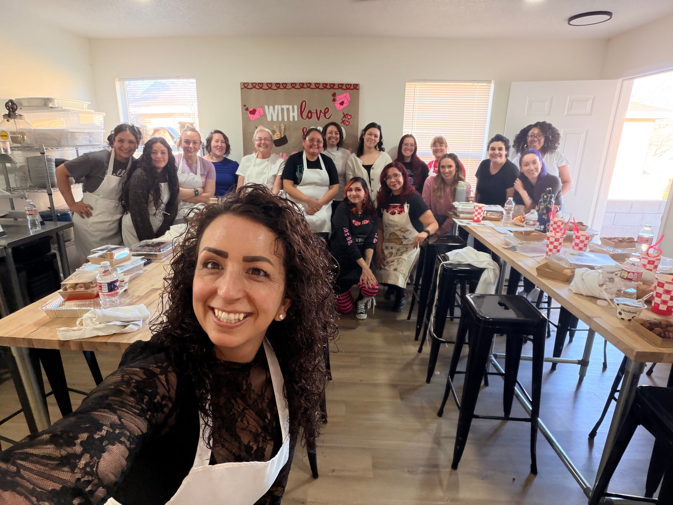 Corporate guests cooking together with Chef Evangalene at Eat Well ABQ