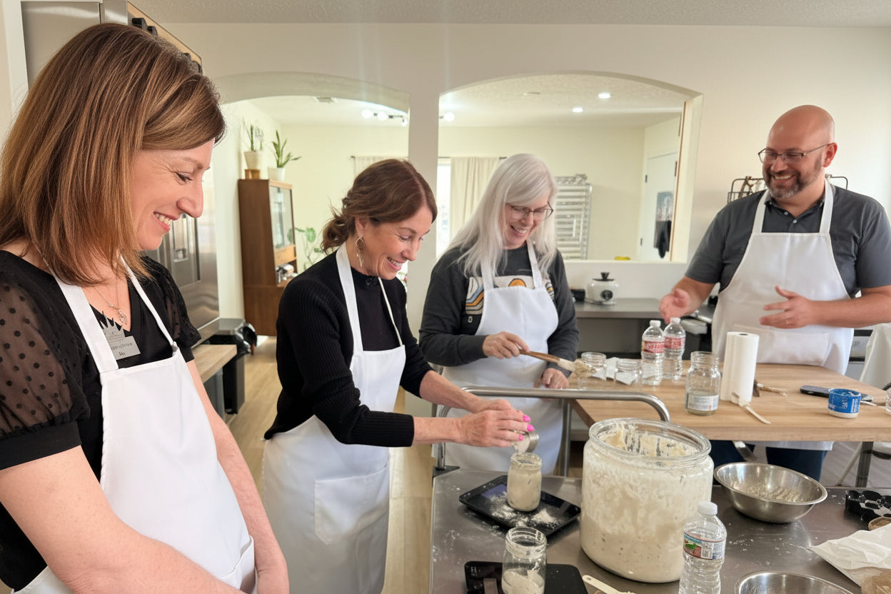 Hands-on sourdough bread class with students learning dough shaping at Eat Well ABQ
