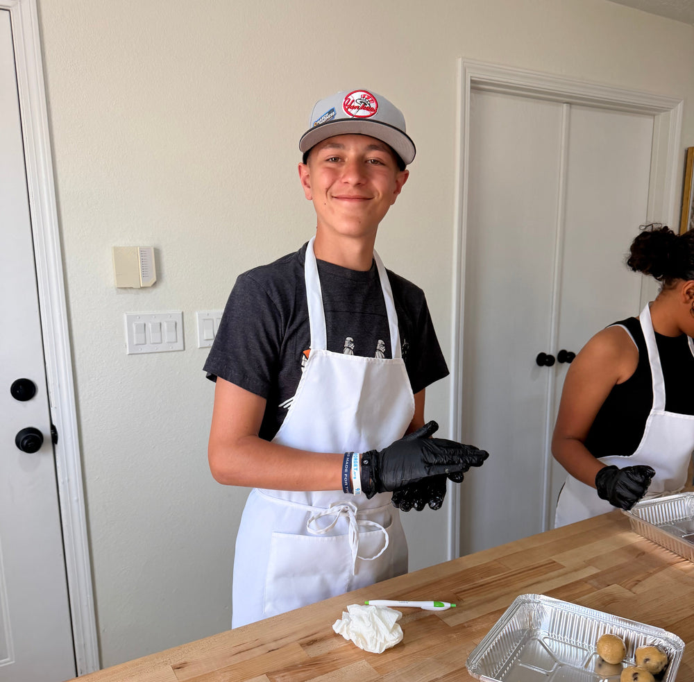 Young cooks learning practical kitchen skills with Eat Well ABQ in Albuquerque