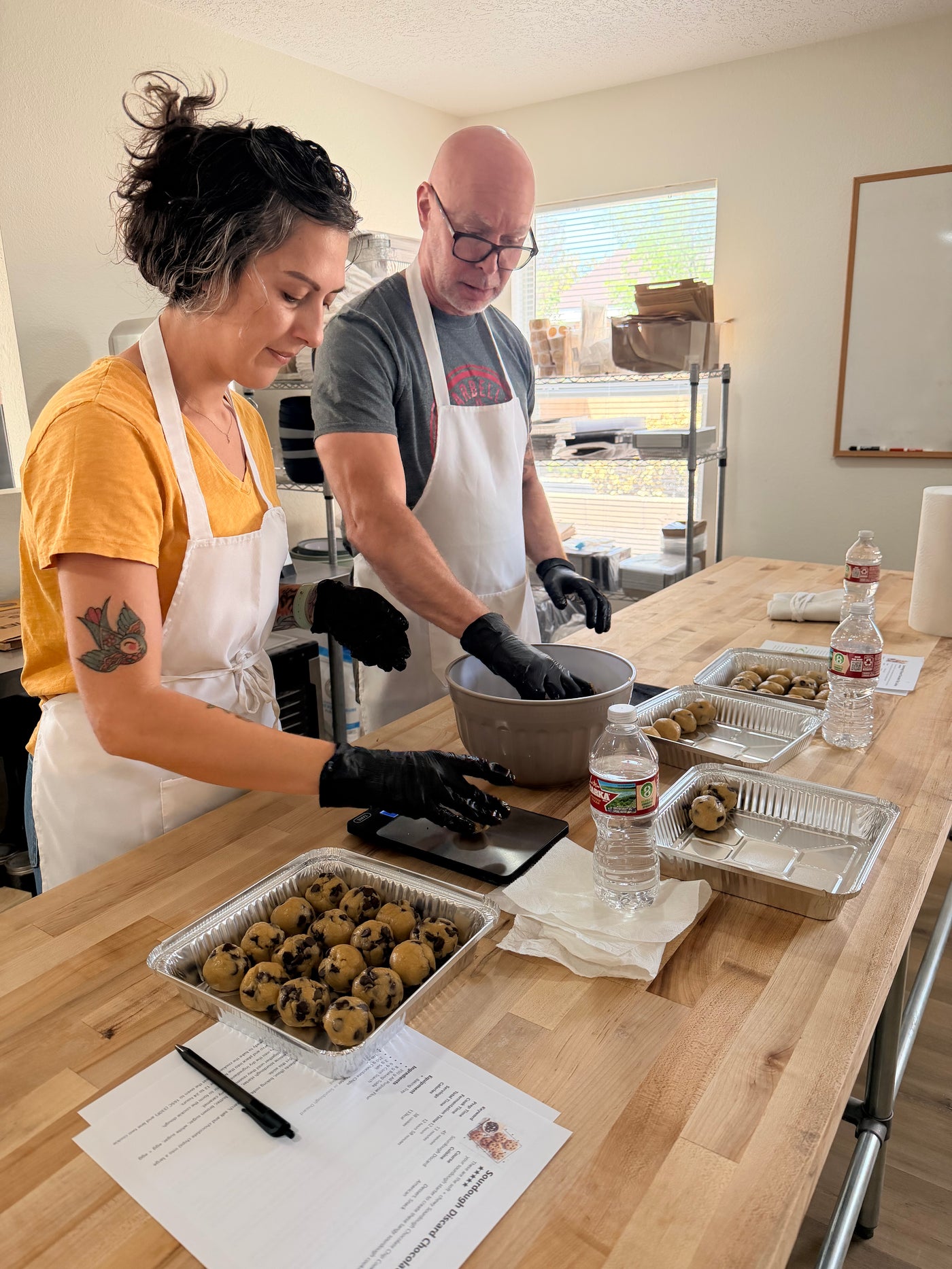 Friends participating in a private specialty baking class with Chef Evangalene in Albuquerque