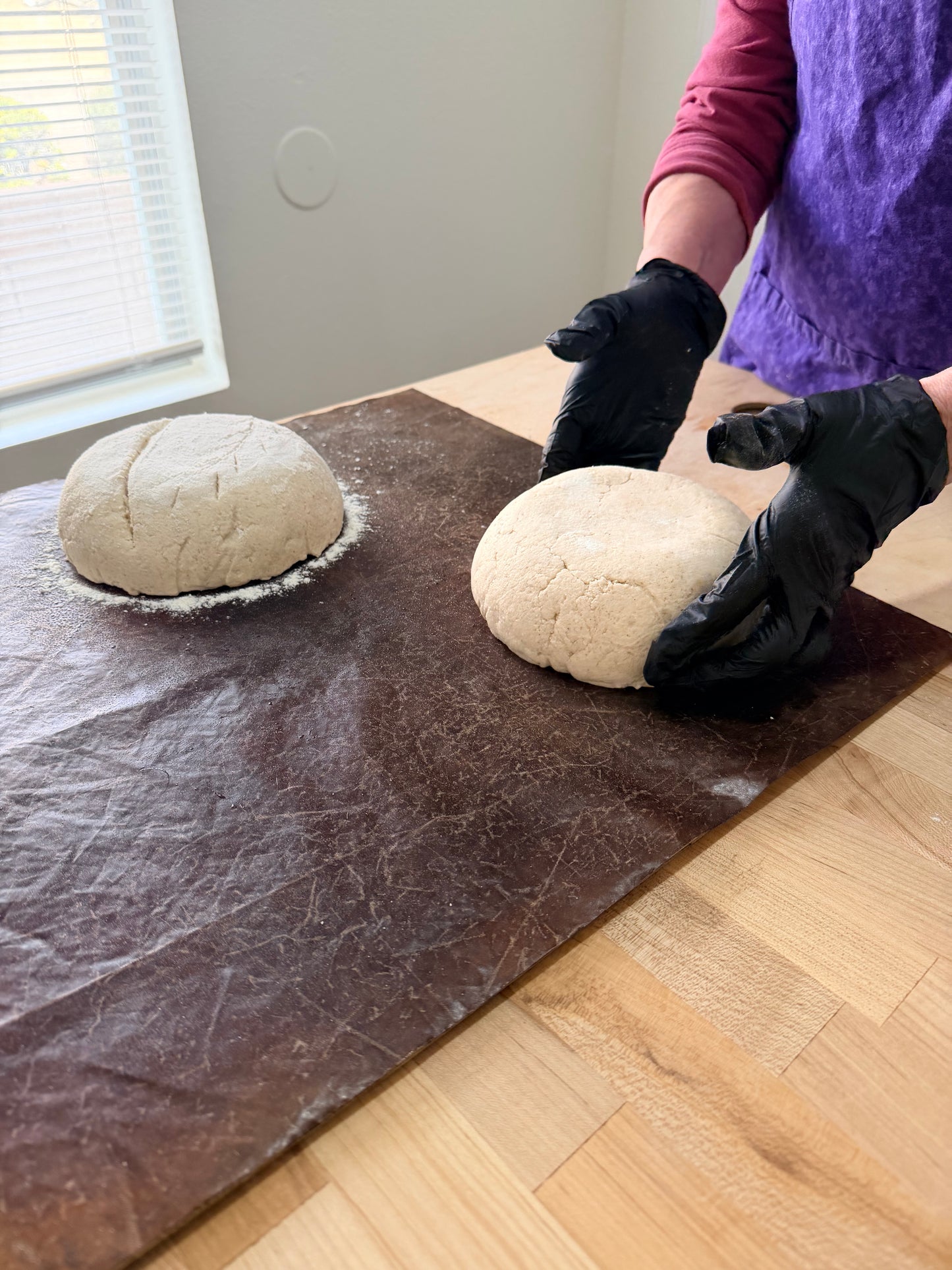 Students learning dough shaping during a sourdough bread class at Eat Well ABQ